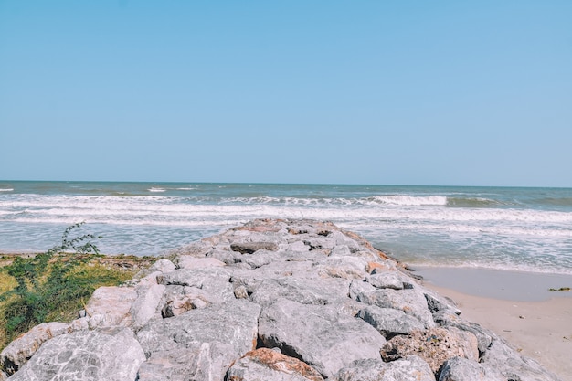 Rock on beach at sea view