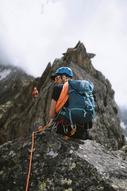 Rock climber going up the chamonix alps in france