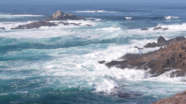 Rock crag of cliff ocean beach point lobos california coast waves crashing