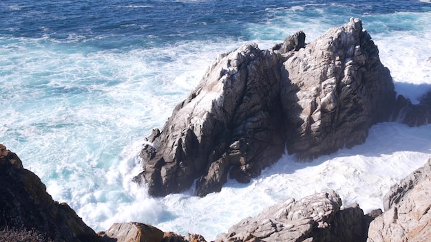 Rock crag of cliff ocean beach point lobos california coast waves crashing