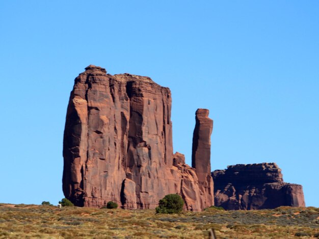 Rock formation against clear blue sky