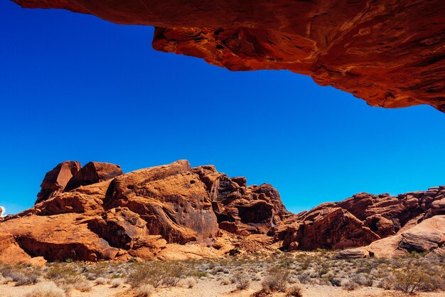 Rock formations against clear blue sky