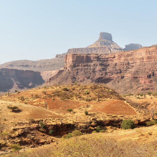 Rock formations on landscape against clear sky