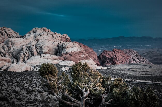 Rock formations on landscape against sky