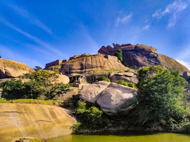 Rock formations on landscape against sky