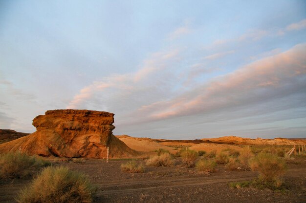 Rock formations on landscape against sky