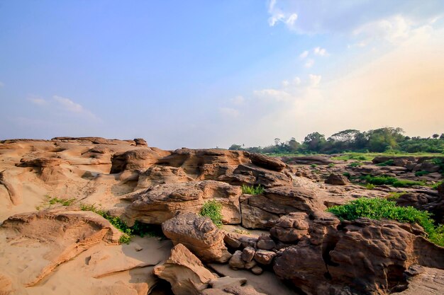 Rock formations on landscape against sky