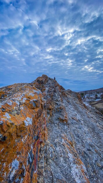 Rock formations on mountain against sky