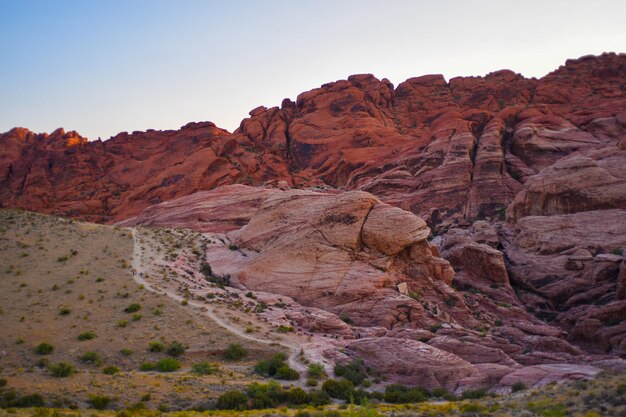 Rock formations in mountains against clear sky