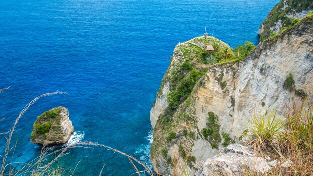 Rock in the ocean at atuh beach on nusa penida island indonesia