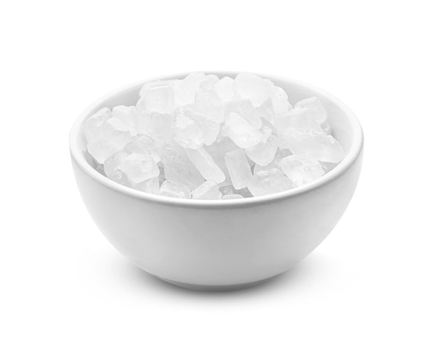 Rock sugar in bowl on white background