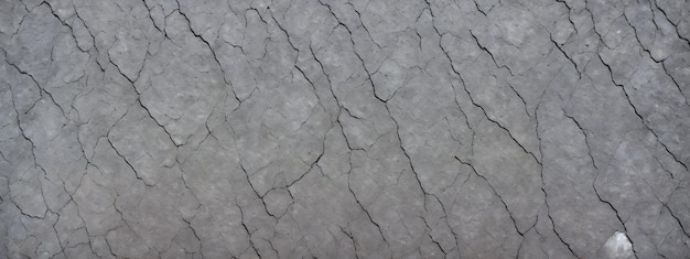 Rock texture with cracks closeup Rough mountain surface Stone granite background for design