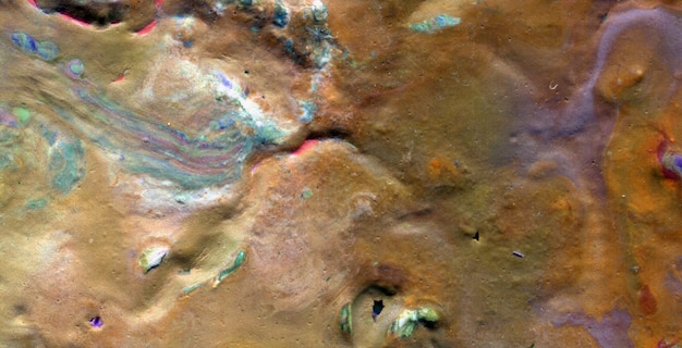 A rock in the water with the word mars on it.