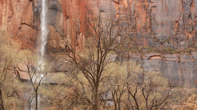 Rock and waterfall, Zion national park, autumn in Utah USA. steep bare cliff. Fall in United States