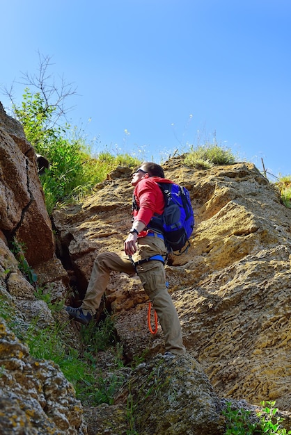 Rockclimber with backpack