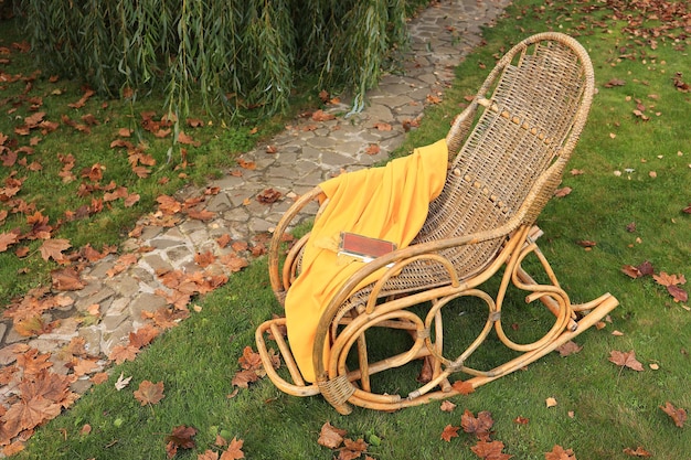 Photo rocking chair in the autumn garden soft focus