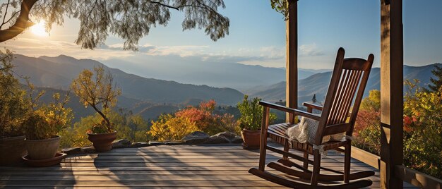 Rocking chair in the warm sunlight on the wooden cottage's terrace