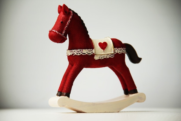 Photo rocking horse on white