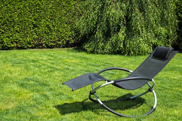 Rocking lounger on a green grass