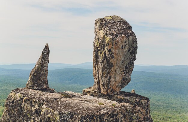 Rocks of Aigir in the smoke of a forest fire Bashkortostan