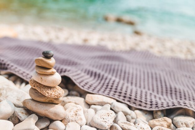 Rocks in balance at sea beach copy space summer time