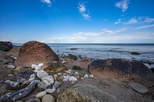 Rocks on beach against sky