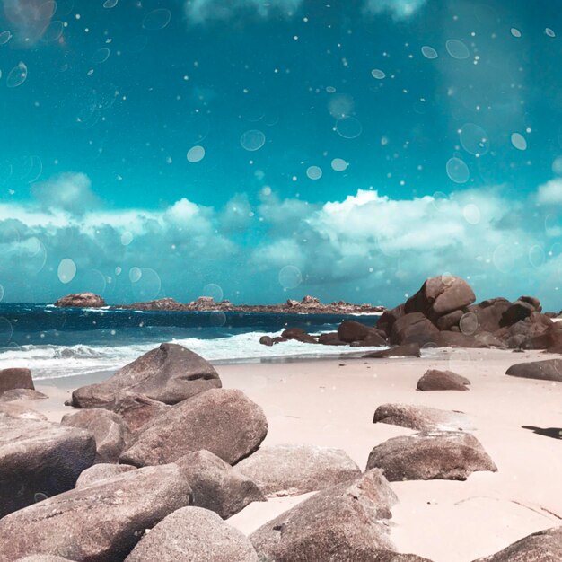 Rocks on beach against sky