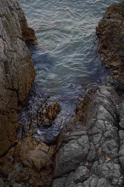 Rocks at the beach calm water