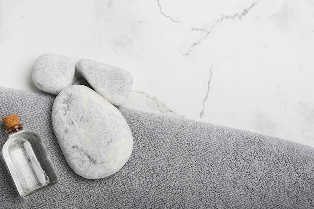 Rocks and container on towel