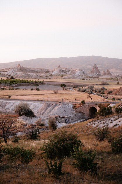 Rocks looking like mushrooms dramatically lit by a sunset in Cappadocia, Turkey