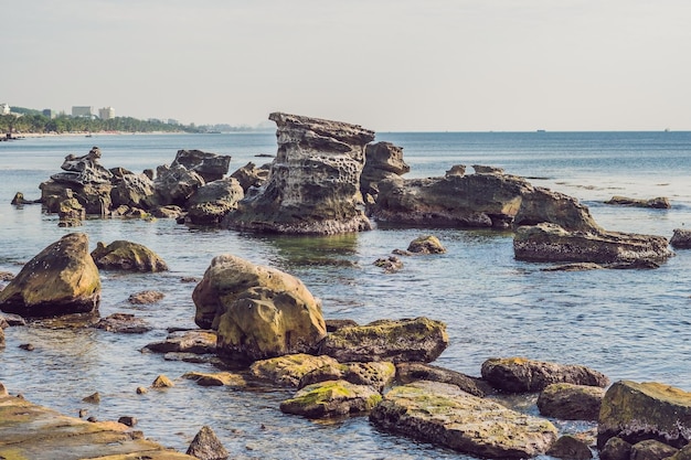 Rocks in the sea and view of the island of Phu Quoc, Vietnam.