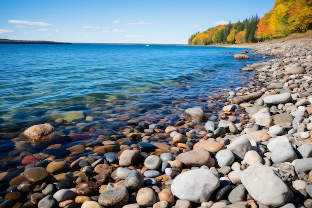 rocks on the shore of a lake at sunset