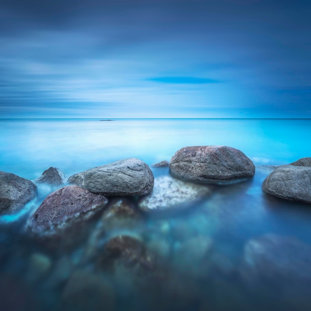 Rocks and soft sea long exposure photography landscape