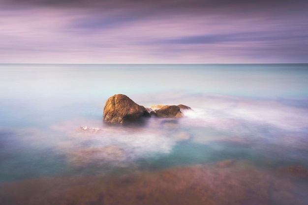 Rocks and soft sea long exposure photography landscape