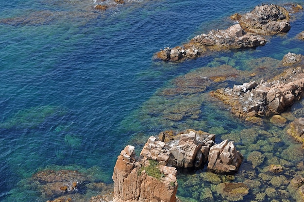 Rocks in the water with the sea in the background