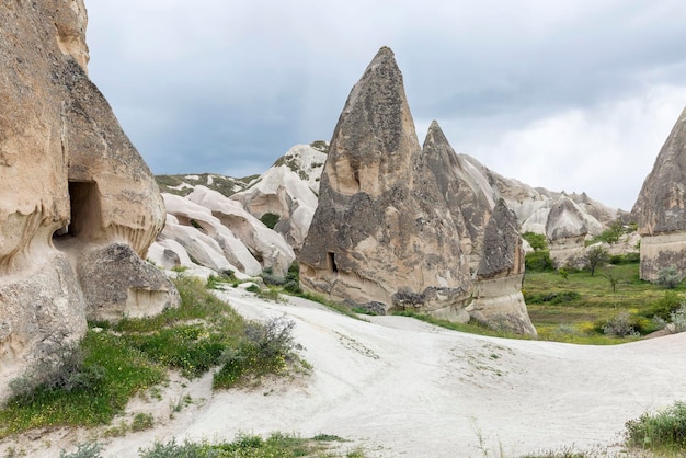 Rocks with caves and hiking trail in a valley in Cappadocia Magnificent landscape