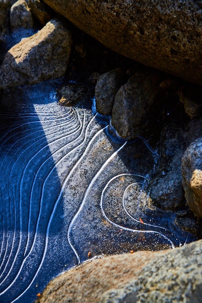 Rocks with wavy frozen ice layers in between