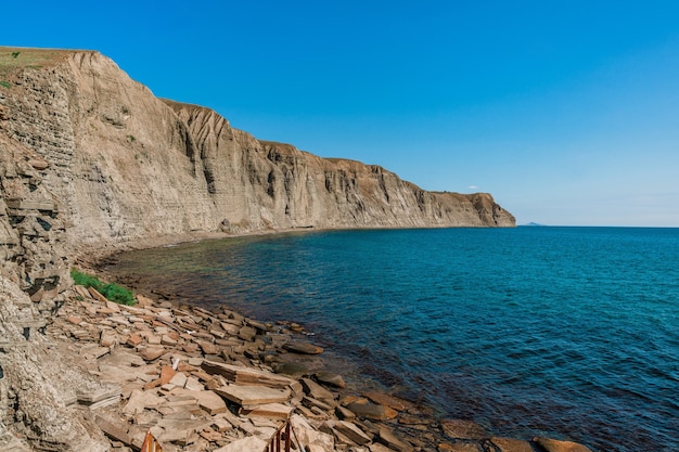 A rocky beach made of natural rectangular stones in the crimea a gloomy lifeless landscape