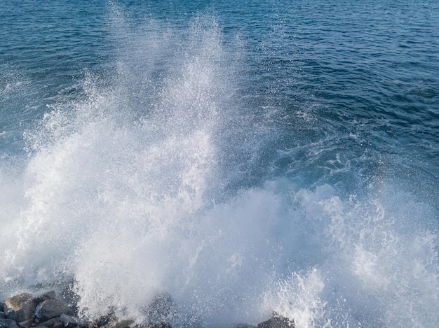 Rocky beach with Atlantic Ocean waves meeting with underwater sharp rocks