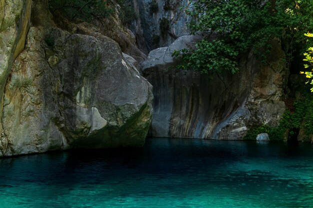 Rocky canyon with clear blue water in Goynuk Turkey