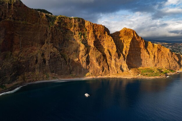 Rocky cliff near blue sea