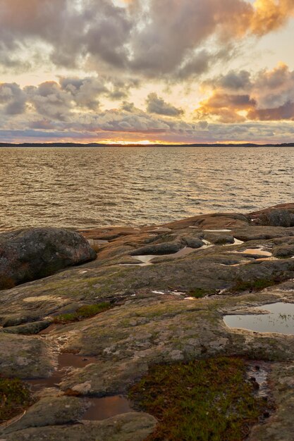 The rocky coast of the Baltic Sea at sunset.