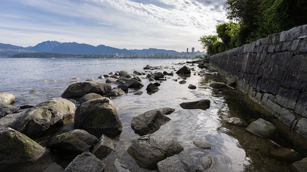 Rocky coast framed by rock wall