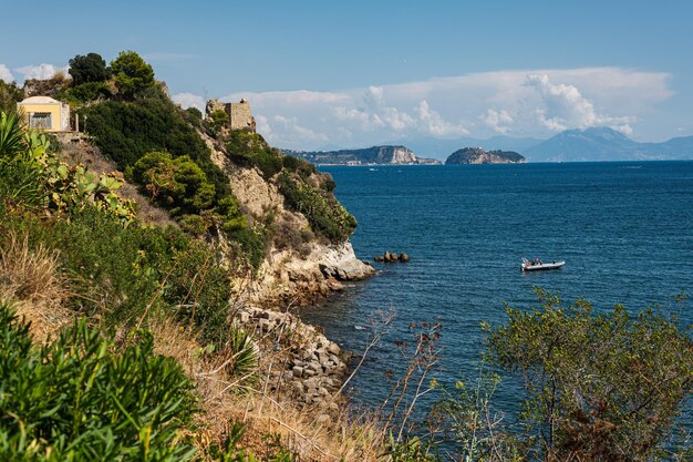 The rocky coast in the south of Italy the city of Baia Calm beautiful sea panorama of the Tyrrhenian Sea