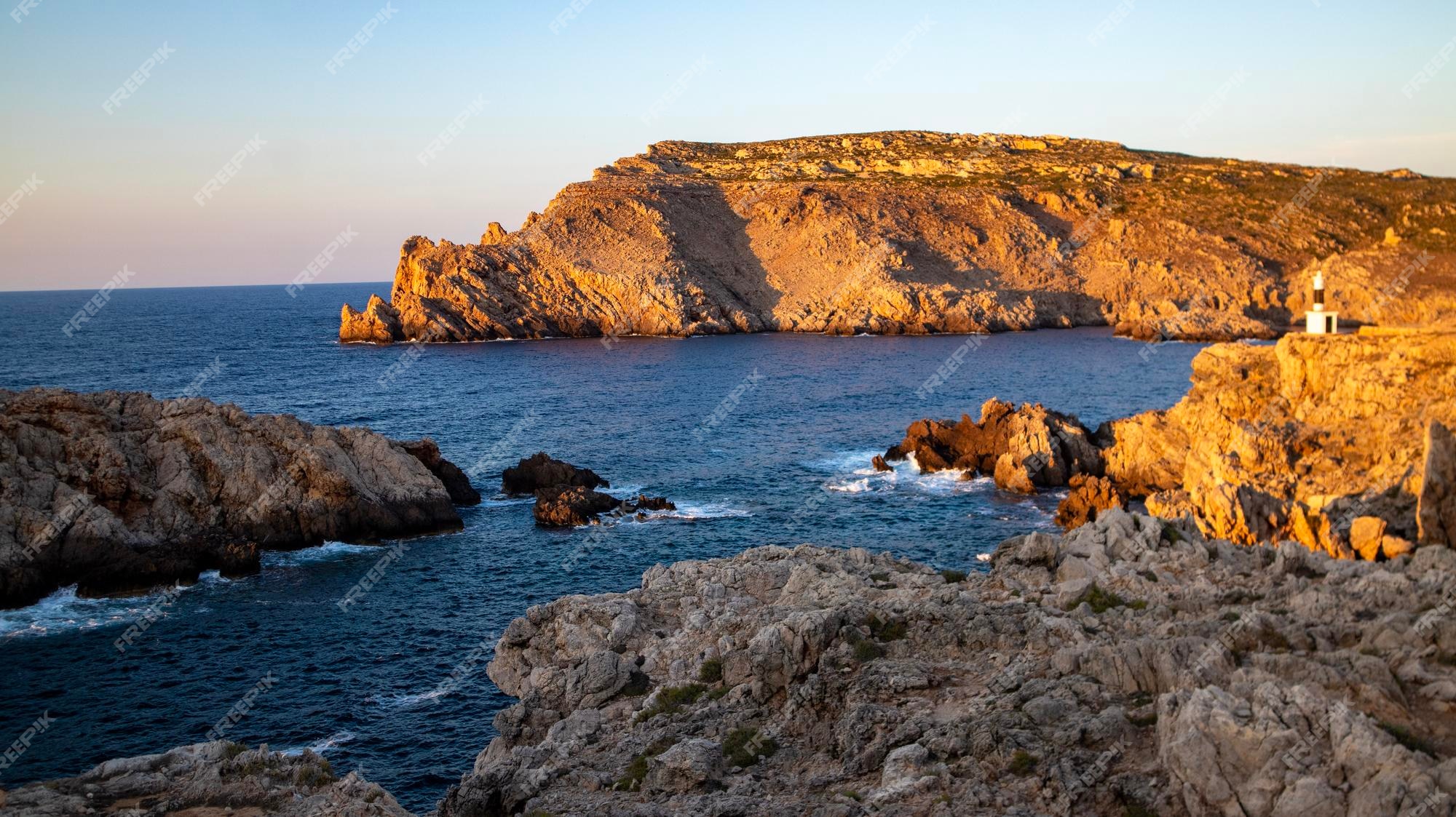 rocky coast with sunset background 526992 998 - Villa Rental Sardinia