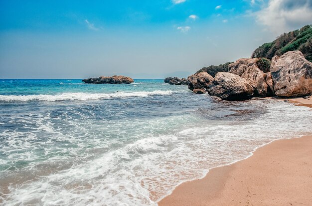 Rocky coastline and azure bay in capo testa sardinia italy