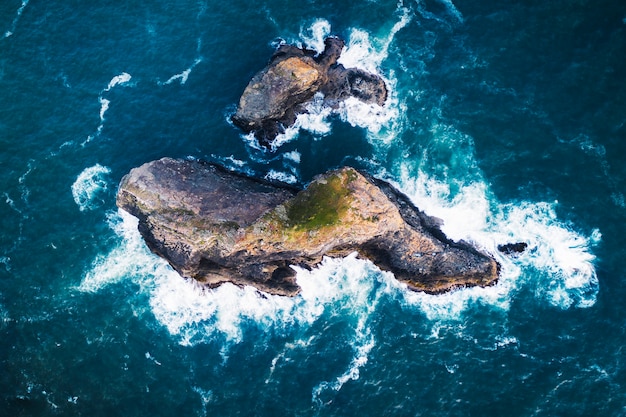 Rocky island among a deep blue ocean