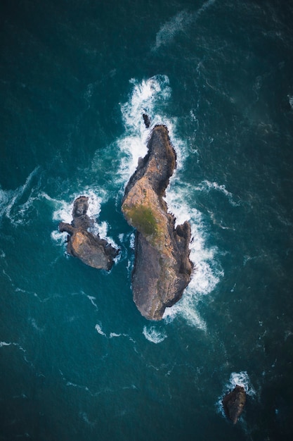 Rocky island among a deep blue ocean