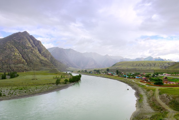 Rocky mountains under a cloudy blue sky Altai Siberia Russia