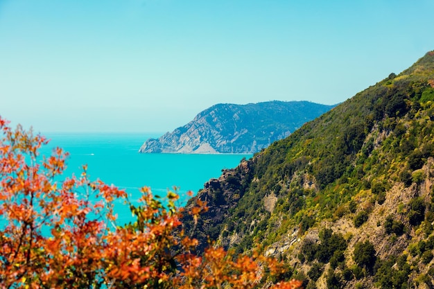 Rocky sea coast at sunset Ligurian sea Monterossa Village Cinqe Terre Italy